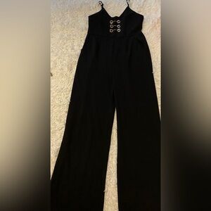 Black stretch jumpsuit size small-medium EUC